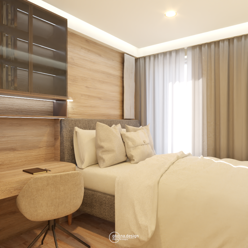 Zdjęcie przedstawia jasne i przestronne wnętrze sypialni. Na pierwszym planie widoczne jest łóżko z białym drewnianym stelażem i ciemnoszarym materacem. Na łóżku znajduje się biała pościel z delikatnym wzorem i miękkie poduszki. Obok łóżka stoi drewniana szafka nocna z lampką. W tle, po prawej stronie łóżka, znajduje się biurko z drewnianym blatem i szufladami. Obok biurka znajduje się wygodne krzesło z brązowym obiciem. Sypialnię zdobią jasne zasłony i białe ściany. Podłoga wyłożona jest drewnianym parkietem. Projekt autrorstwa Pracowni wnętrz oko.na.design