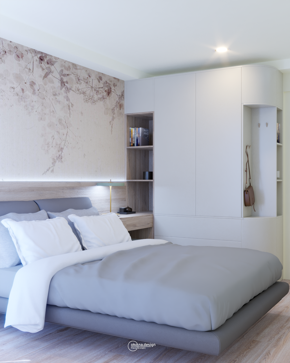 Sypialnia z łóżkiem, szafą i półkami Opis: Na zdjęciu przedstawiona jest sypialnia. W centralnej części pomieszczenia znajduje się łóżko z brązowym drewnianym stelażem i ciemnoszarym materacem. Po lewej stronie łóżka ustawiono kaszmirową szafę. Na przeciwległej ścianie widoczne są drewniane półki na książki i dekoracje. Podłoga wyłożona jest jasnymi panelami laminowanymi, a ściany pomalowane są na biało. W tle widać okno z zasłonami. Dodatkowe informacje: W sypialni panuje jasny i przytulny klimat. Meble są proste i funkcjonalne. Łuki. Pomieszczenie jest czyste i uporządkowane. Pracownia wnętrz oko.na.design. Klaudia Szendzielarz